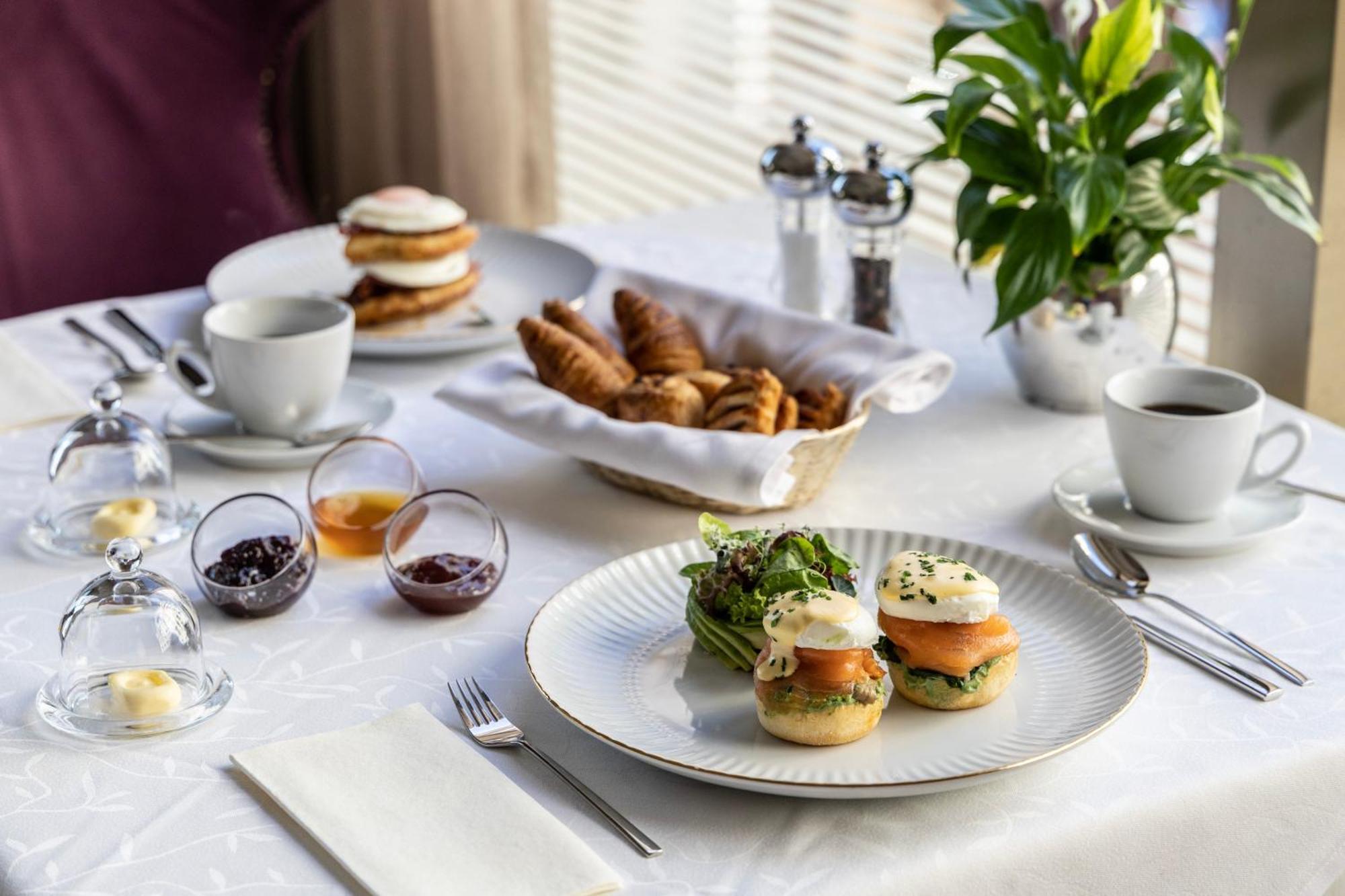 Njv Athens Plaza Hotel Exterior photo A breakfast table with a selection of dishes