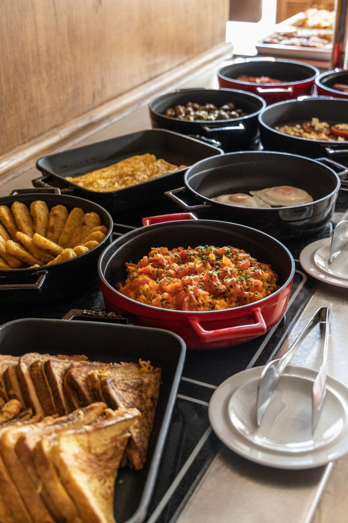 Njv Athens Plaza Hotel Exterior photo A selection of dishes at a buffet